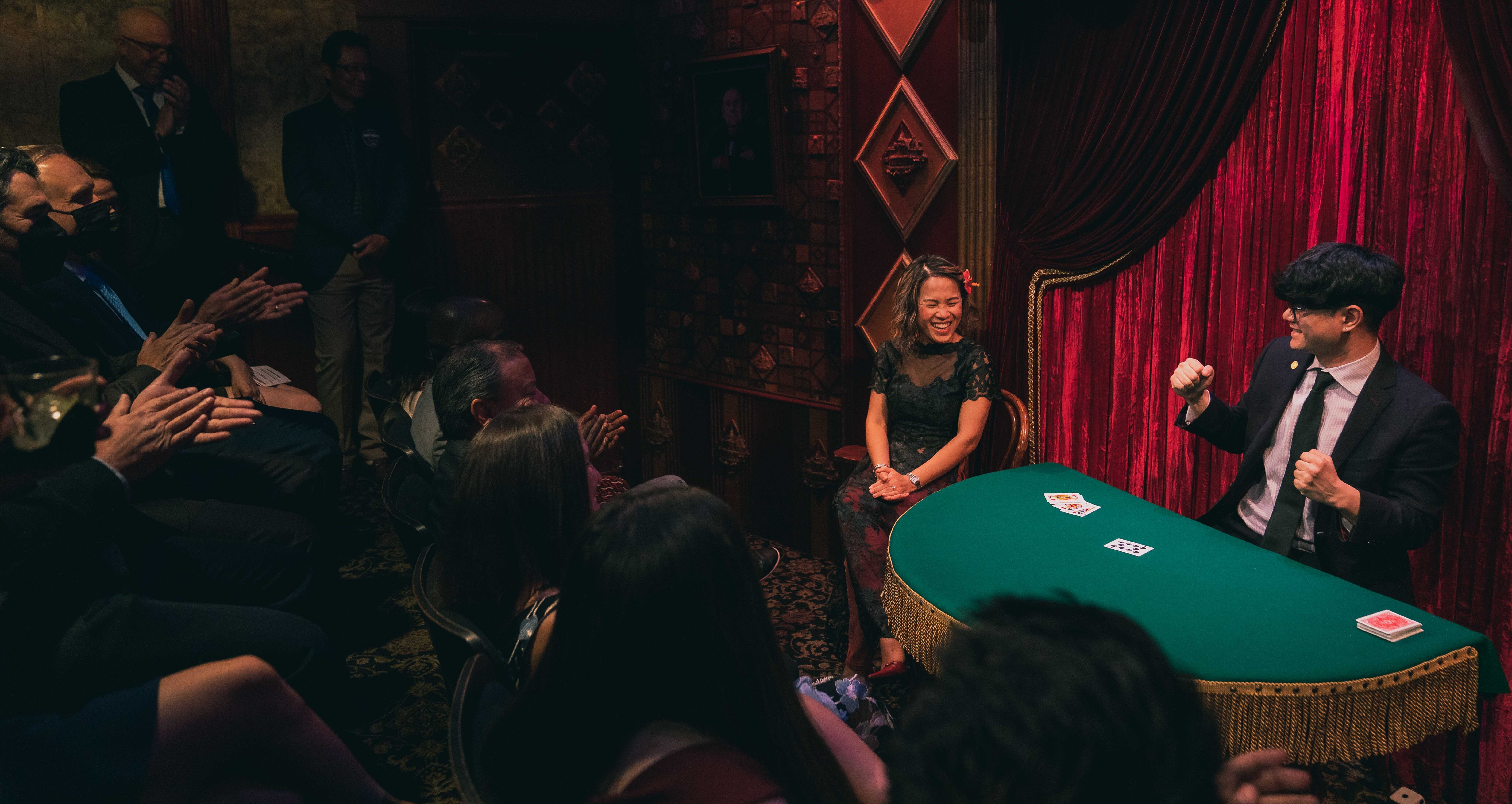 Seattle magician Travis Kim performing close-up magic at an event